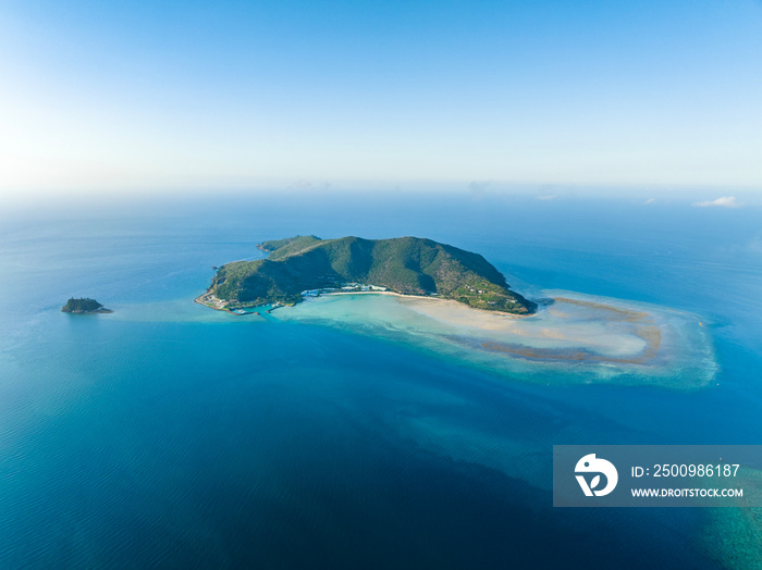 Stunning aerial drone view of Hayman Island, the most northerly of the Whitsunday Islands in Queensland, Australia, near the Great Barrier Reef. Popular tourist destination with a resort hotel.