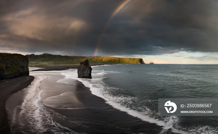 Black Sand Beach Reynisfjara in Iceland. Windy Morning. Ocean Waves. Colorful Sky. Morning Sunset.