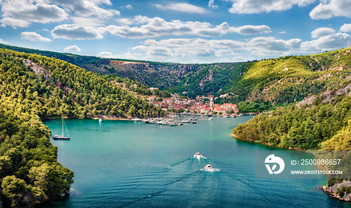 Aerial morning vire of Krka National Park, Prokljansko lake, Croatia, Europe. Picturesque summer cityscape of Skradin port. Beautiful world of Mediterranean countries. Traveling concept background.