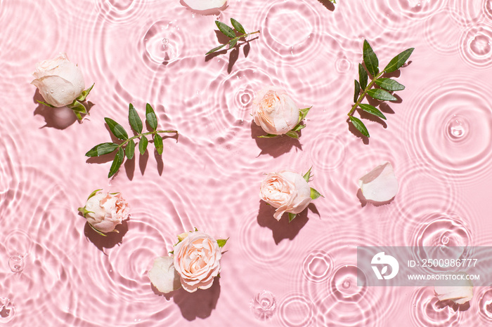 Water background. Pink aqua texture, surface of ripples, transparent, flower, shadows and sunlight. Spa and cosmetic concept background. Flat lay, top view, copy space, banner