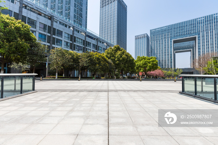 Panoramic skyline and modern business office buildings with empty road,empty concrete square floor