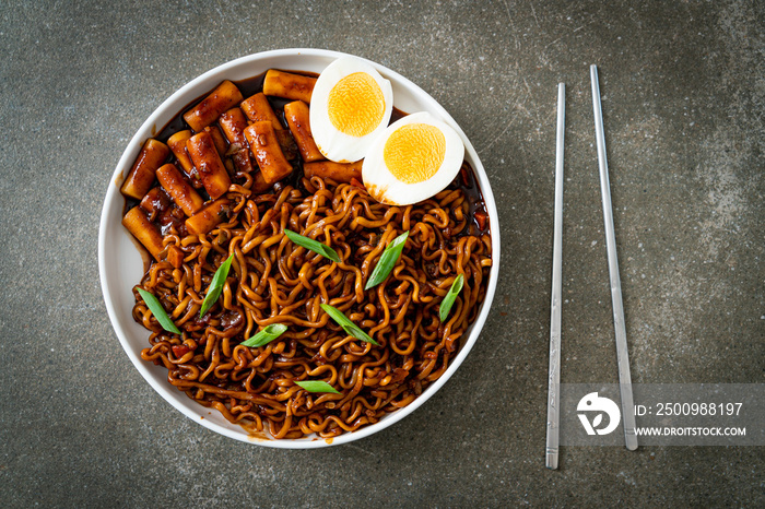 Jjajang Rabokki - Korean instant noodles or Ramyeon with Korean rice cake or Tteokbokki and egg in black bean sauce