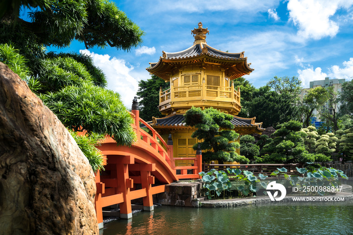 Front view the Golden pavilion temple with red bridge in Nan Lian garden, Hong Kong. Asia.