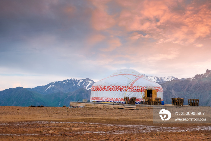 yurt nomad house in the mountains in the evening at sunset