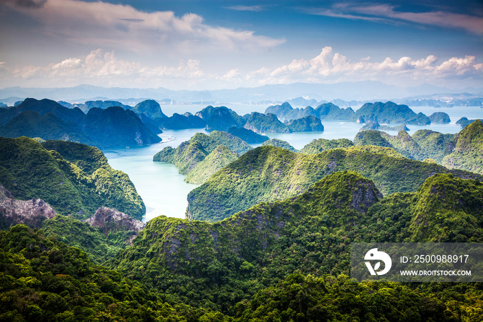 scenic view over Ha Long bay from Cat Ba island, Ha Long city in the background, UNESCO world heritage site, Vietnam