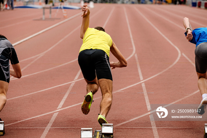 start runners sprinters 100 meters race track and field competition