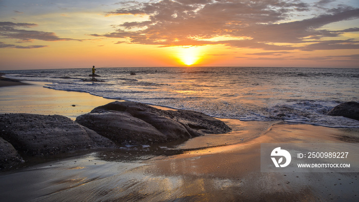 A fisherman at sunset on Playa las Pocitas, Mancora, Peru