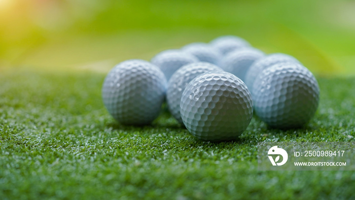 Golf ball on green grass with blur background