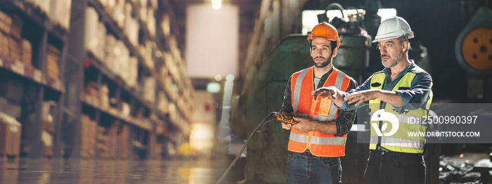 professional technician engineer with safety helmet hard hat working in industrial manufacturing factory, men at work to checking equipment of machinery production technology or construction operating