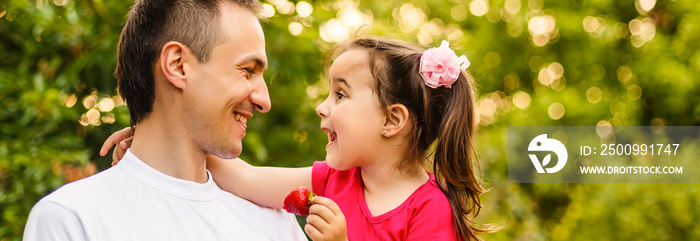 Portrait of little girl hugging her daddy