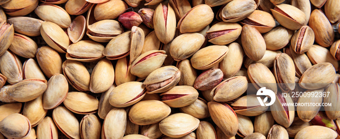 Pistachios with shell full background, banner, closeup