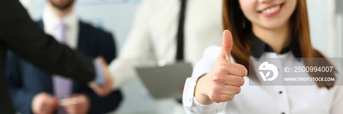 Woman showing confirm symbol during conference in office as high level and quality of product or mediation gratitude concept