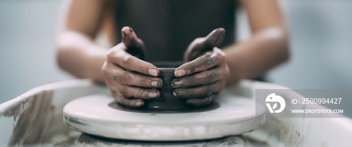 The woman’s hands close up, the masterful studio of ceramics works with clay on a potter’s wheel.