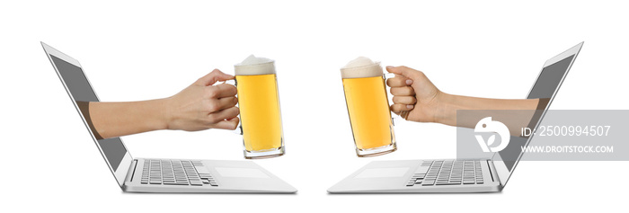 People clinking mugs of beer through screens of laptops against white background. Concept of social distance during coronavirus epidemic