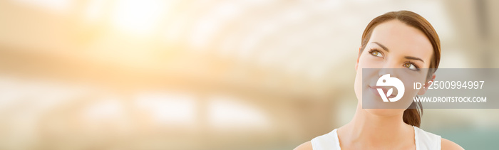 Contemplative Young Adult Woman Looking Off To The Side with Room For Text.