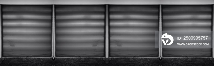 Steel shutter door of warehouse, storage or storefront for metal door background and textured.