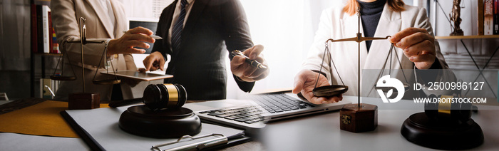 Business and lawyers discussing contract papers with brass scale on desk in office. Law, legal services, advice, justice and law concept picture with film grain effect