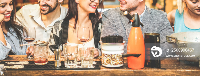 Fashion trendy friends drinking cocktails and wine in vintage bar at happy hour - Young students having party in pub restaurant - Fun and friendship concept - Focus on center woman face