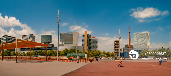 Barcelona, Spain – July 15, 2012: Modern architecture at new districts of Barcelona at summer sunny hot day and blue sky during warm sunset colors. Panoramic view.