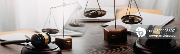 Business and lawyers discussing contract papers with brass scale on desk in office. Law, legal services, advice, justice and law concept picture with film grain effect