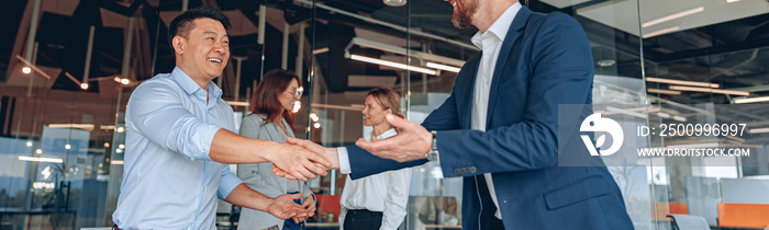 colleagues are shaking their hands in modern office during teamwork. High quality photo