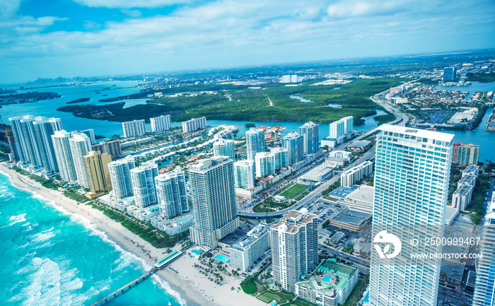 Helicopter aerial view of Miami Beach and city causeway