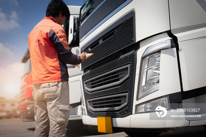 Auto Mechanic Driver holding Clipboard Checking Maintenance and Safety Program of Semi Truck.