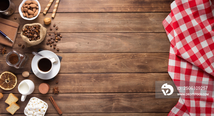 coffee beans with cup at wooden table background