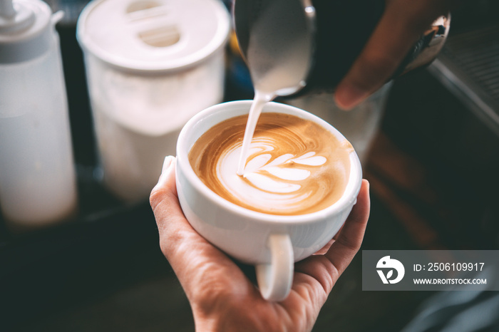 Barista made coffee latte in a coffee shop.