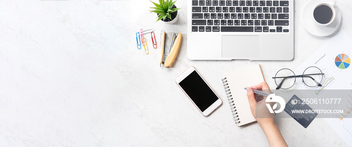 Concept of a woman is doing a online purchase, mock up card and cellphone on office desk isolated on