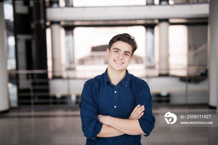 handsome young man smiling indoors