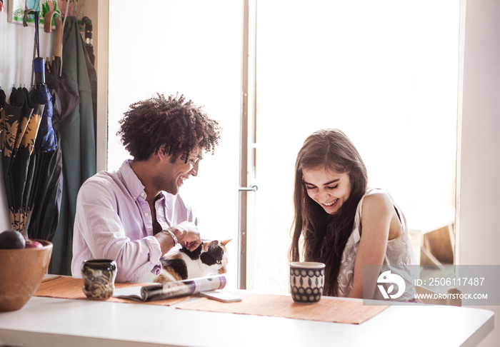 Couple with cat at home