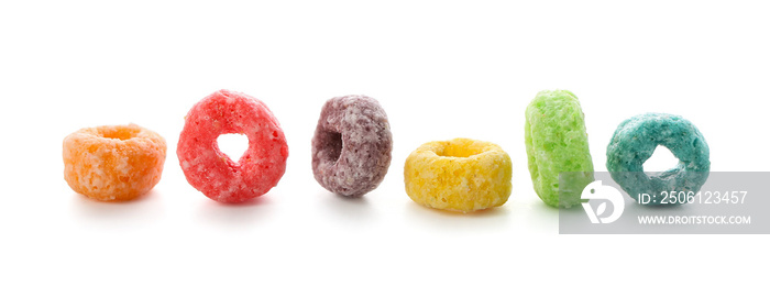 Tasty cereal rings on white background