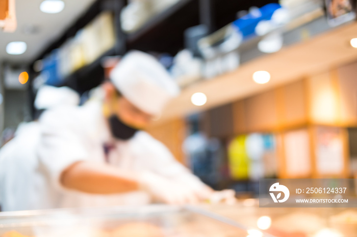 Blur of portrait of chef cooking in the japanese kitchen.