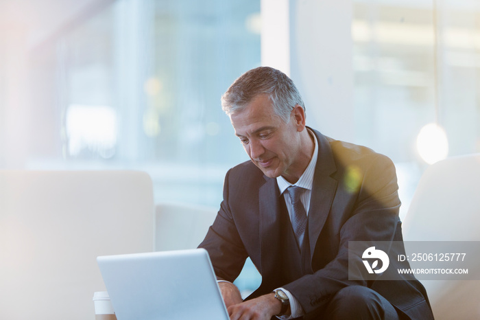 Corporate businessman using laptop