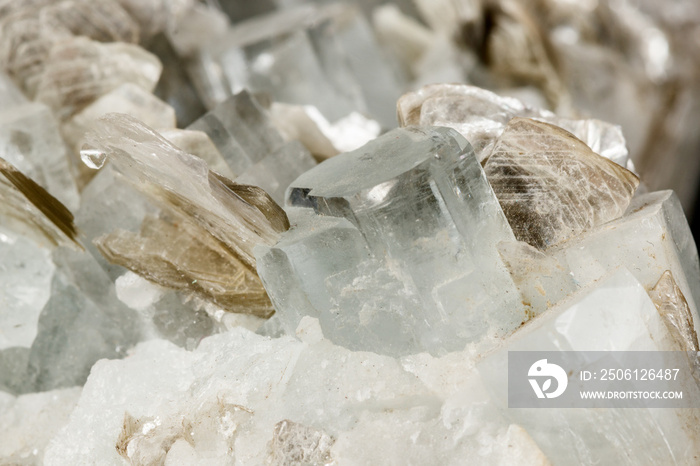 Macro mineral stone Aquamarine in rock on a black background