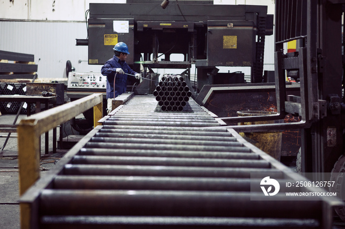 Side view of man working in factory