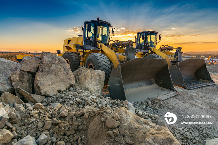 Two excavators removing stone in the construction works of a road