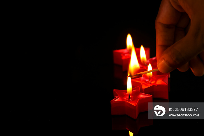 Indian festival diwali , candle on dark background