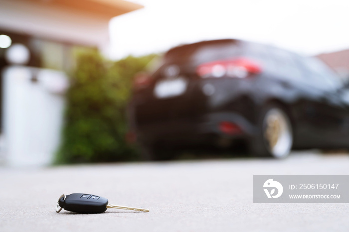 abstract lost car keys fall lying on the street concrete cement ground roadway office front yard. tr