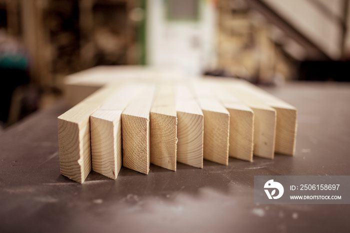 Surface level of wooden planks arranged side by side on table in workshop