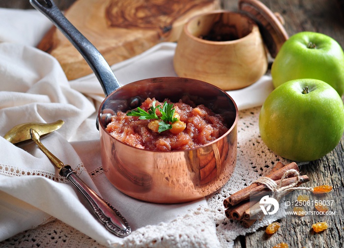 Homemade apple chutney with raisins, cinnamon, chili and other spices.