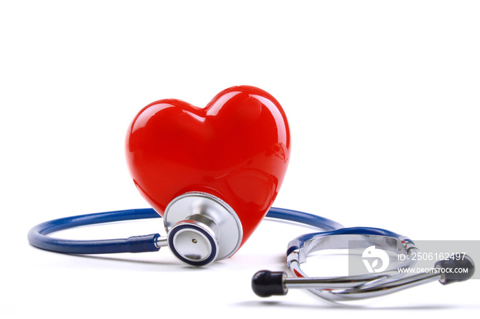 Red heart and a stethoscope on desk