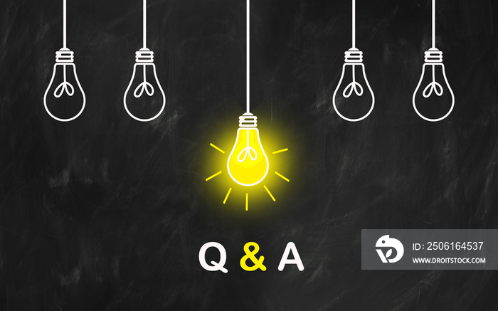 questions and answers with light bulb on black board : Q AND A text. Q & A