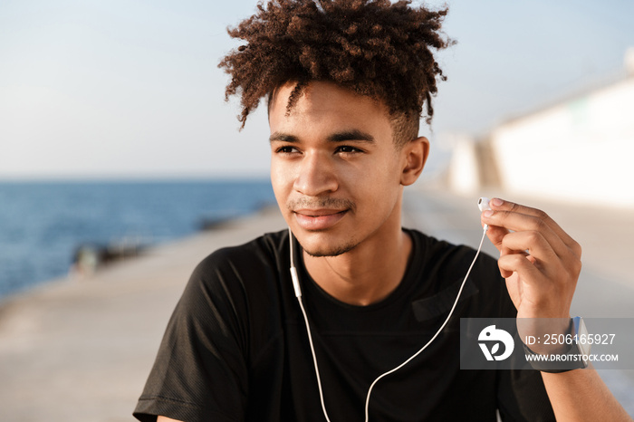 Close up of a young african teenager at the beach