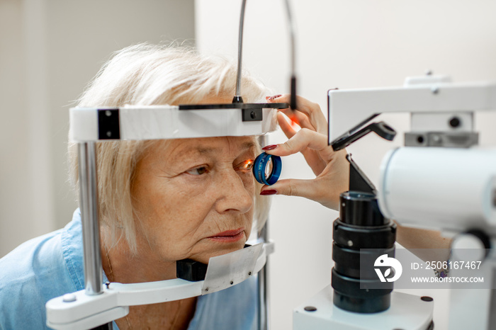 Senior woman during a medical eye examination with microscope in the ophthalmologic office