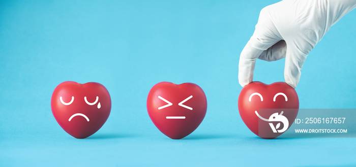 Doctor hands with medical gloves holding red heart, heart health,saving life.