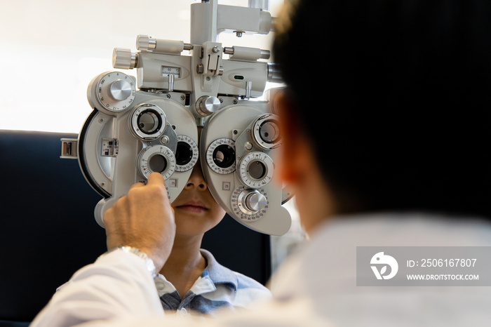 optometrists are examining pediatric patients eyes with the Autorefractor