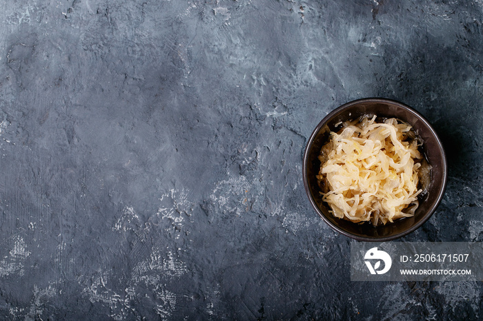 Red and white sauerkraut in ceramic bowl