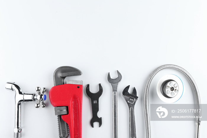 Plumbers items on white background